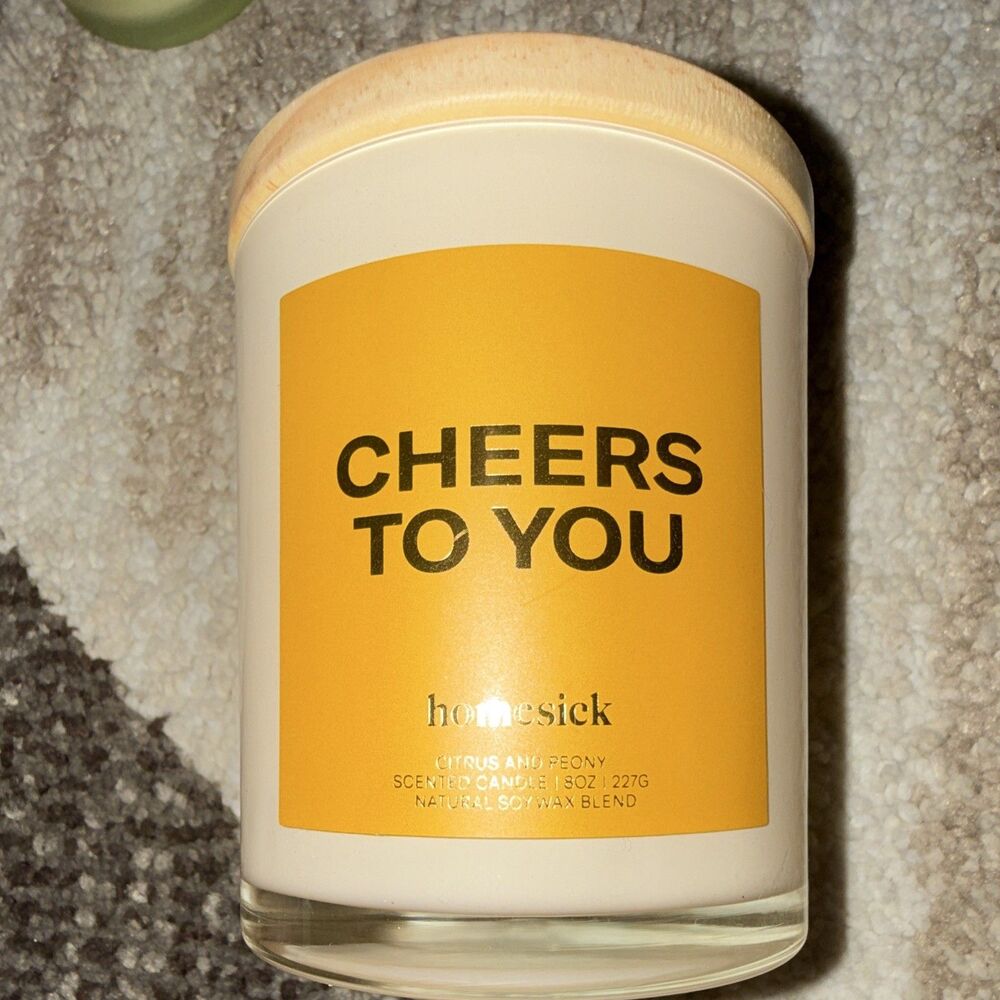 Homesick Cheers to You Scented Candle. Single Wick In Glass Container with Lid